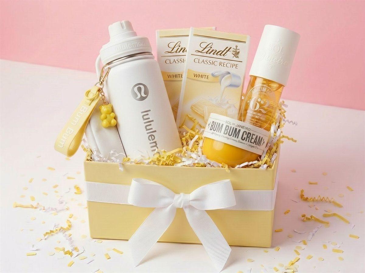 A yellow gift box tied with a white bow