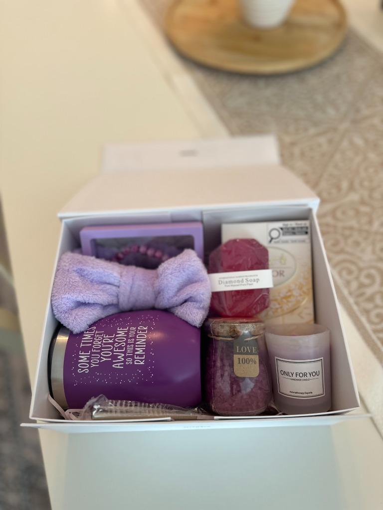 The white gift box, open on a table, packed and waiting for its lid
