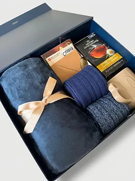 The navy box open, everything set in place